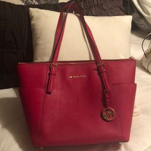 Red Michael Kors handbag